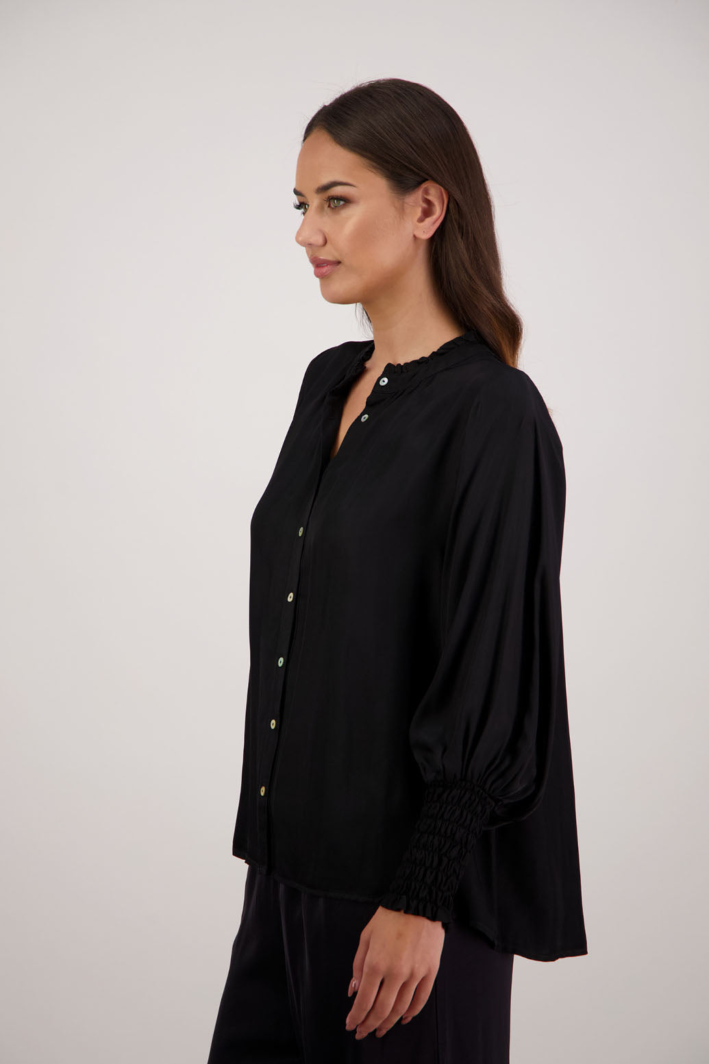 Bestseller. Audrey Shirt in Black by Briarwood NZ. 100% viscose shirt with full length sleeves, ruffle around neck, button through, shirred wrists