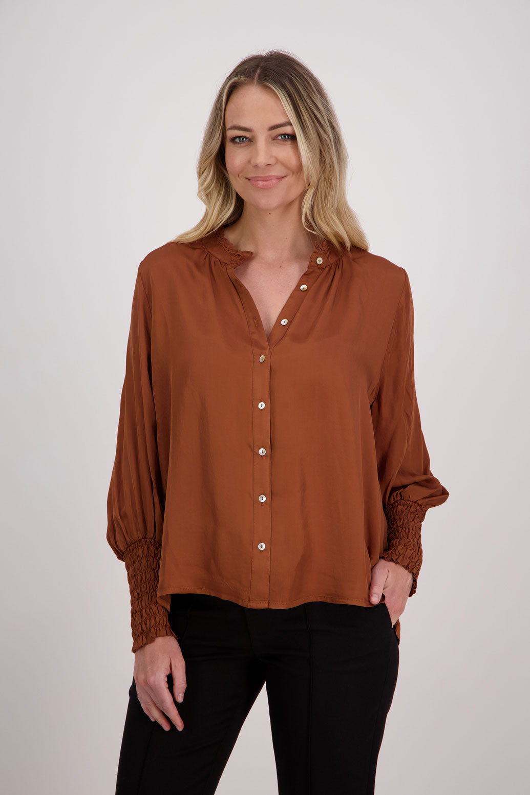 Tan Viscose long sleeve shirt with ruffle collar and shirred sleeves with ruffle. Audrey