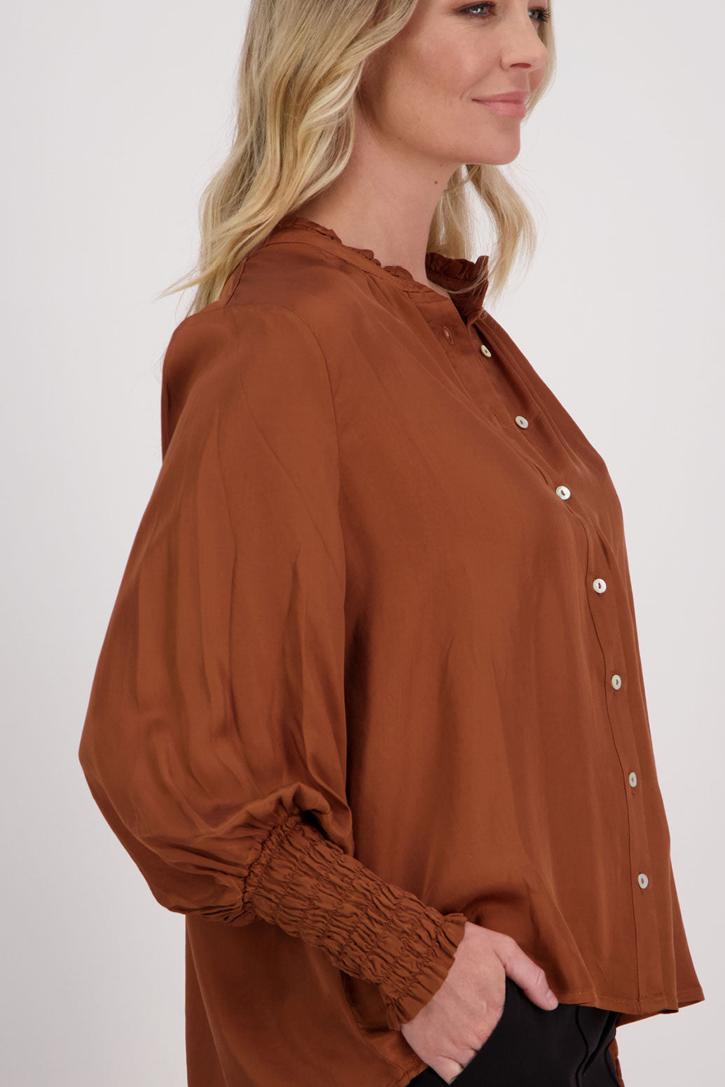 Tan Viscose long sleeve shirt with ruffle collar and shirred sleeves with ruffle. Audrey