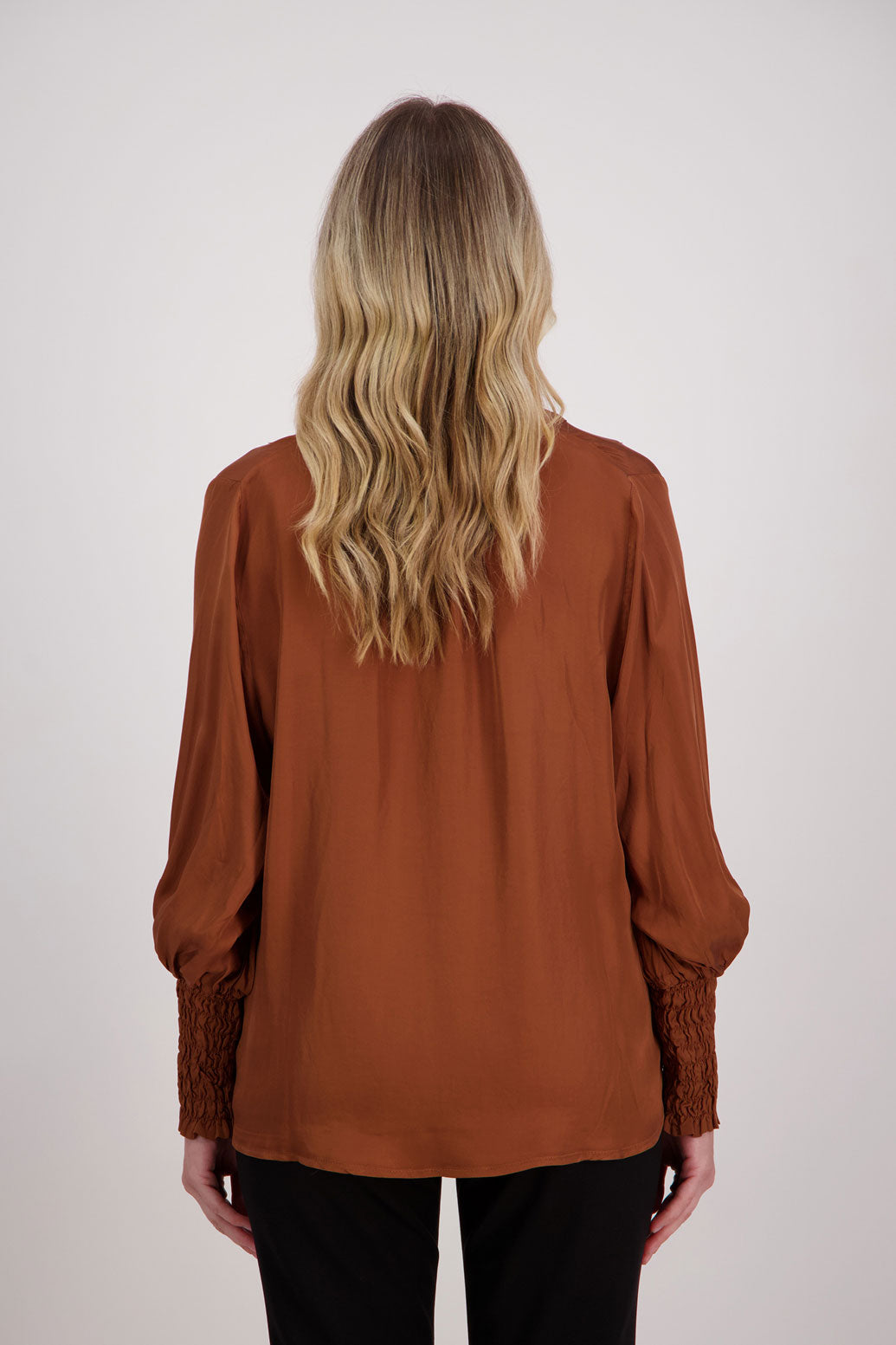 Tan Viscose long sleeve shirt with ruffle collar and shirred sleeves with ruffle. Audrey