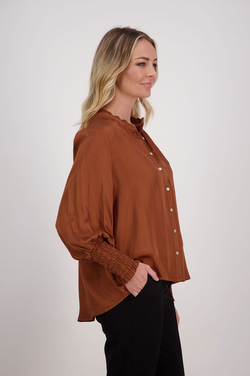 Tan Viscose long sleeve shirt with ruffle collar and shirred sleeves with ruffle. Audrey