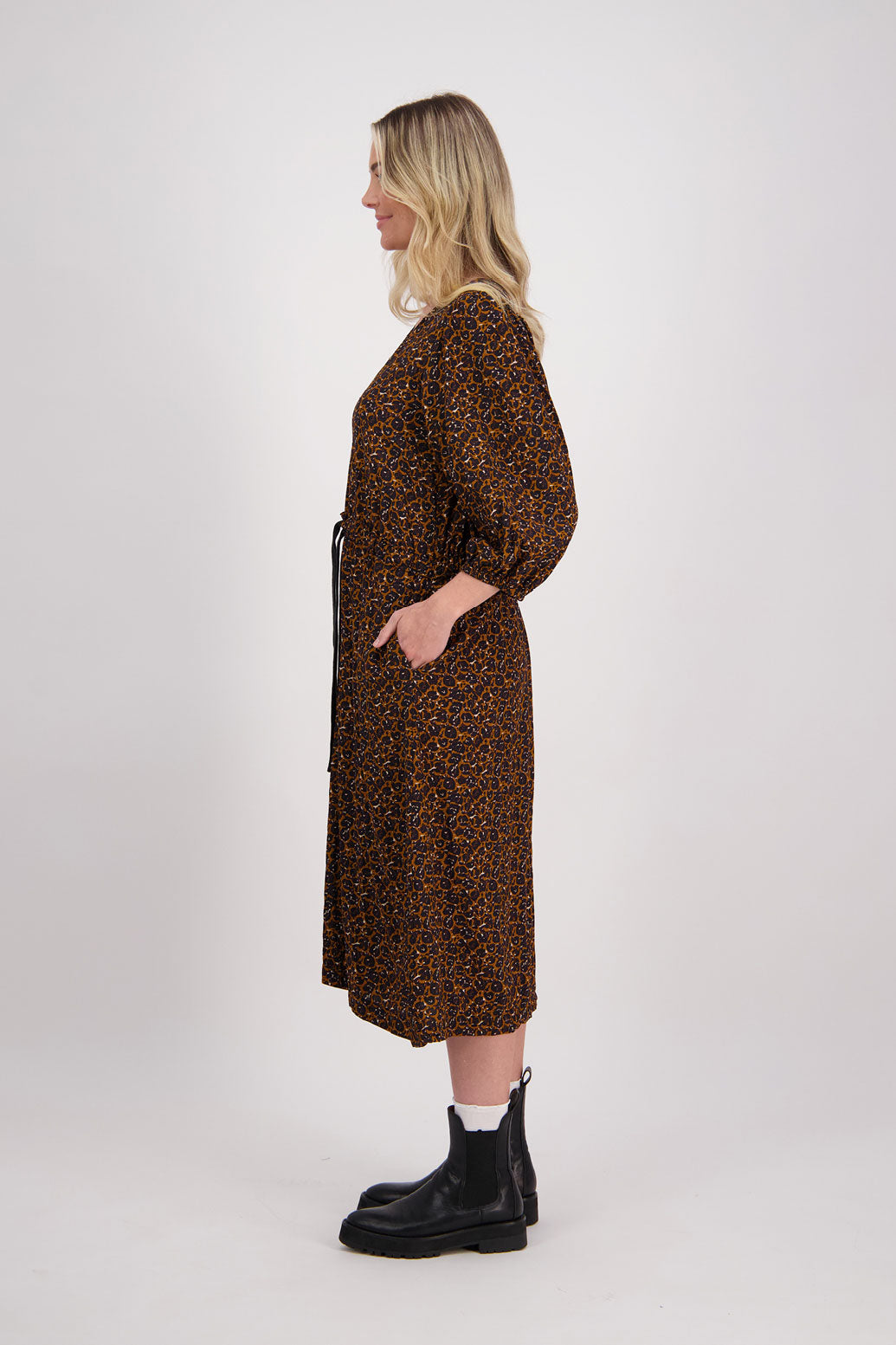 Brown Animal Briarwood visose N neck midi dress. Drawstring around the waist to create the perfect fit. Slight puff on gathered shoulders. Cara