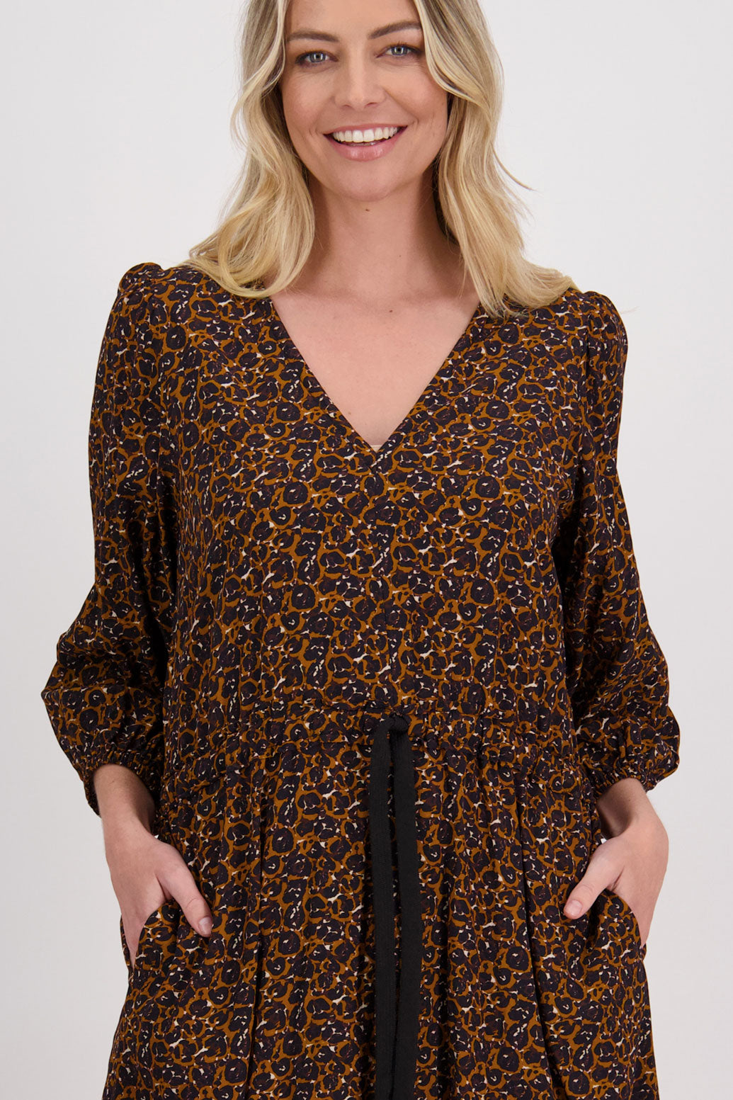 Brown Animal Briarwood visose N neck midi dress. Drawstring around the waist to create the perfect fit. Slight puff on gathered shoulders. Cara