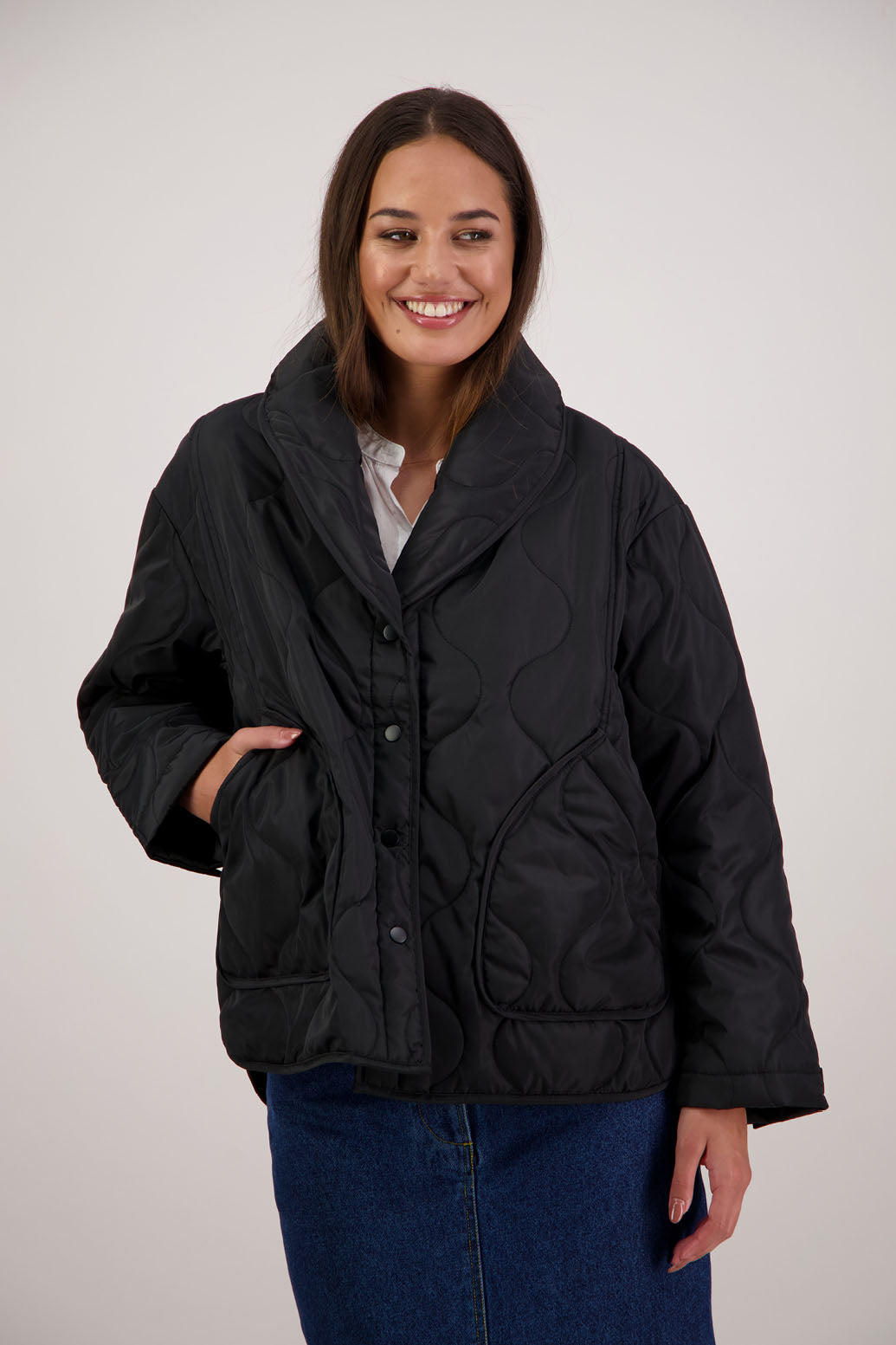 BESTSELLER. Chapman Quilted Jacket in Black by Briarwood NZ. High collar, side split detail, buttons front, stitched on pockets, slightly longer in the back, box fit, lined