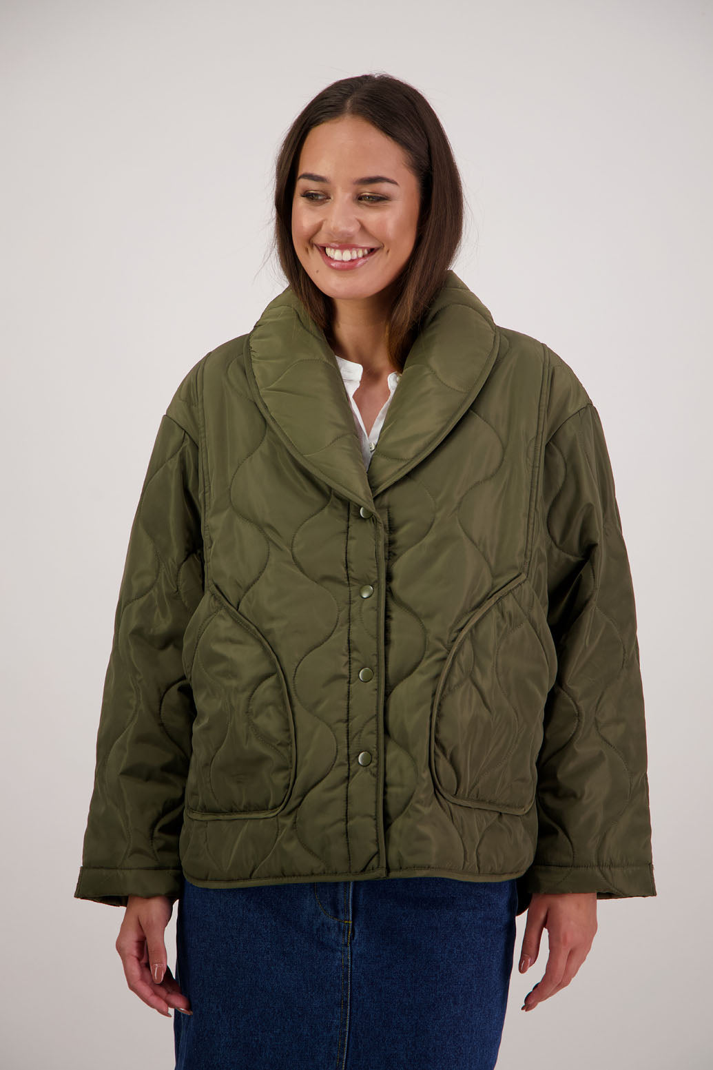 BESTSELLER. Chapman Quilted Jacket in Khaki by Briarwood NZ. Quilted swirl design, high collar, side split detail, buttons front, stitched on pockets, slightly longer in the back, box fit, lined