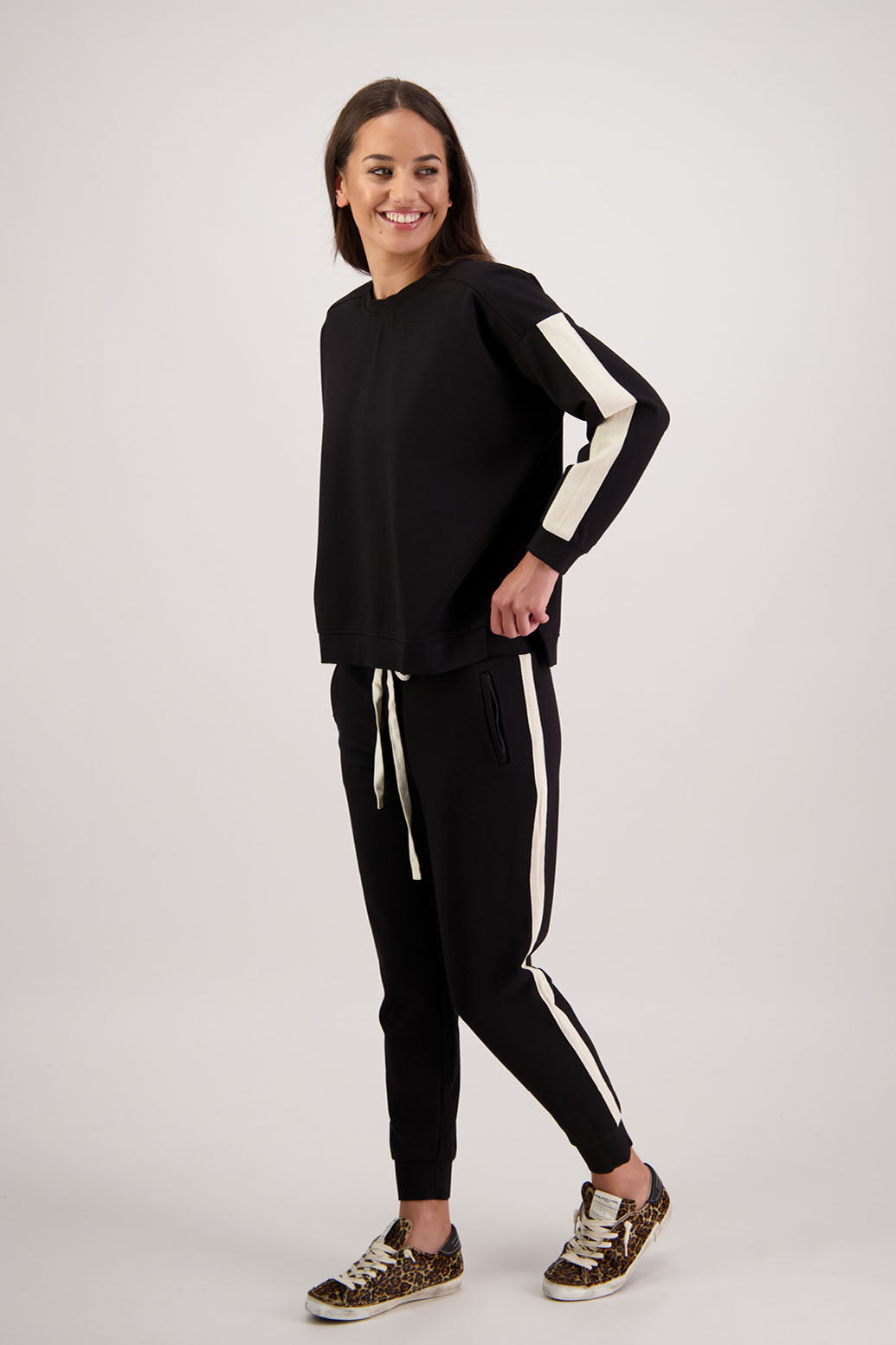 BESTSELLER. Claudia Pant by Briarwood NZ. Pont Pant with zip pockets, elastic waist with tie cord, cuffed legs and contrast side stripe.