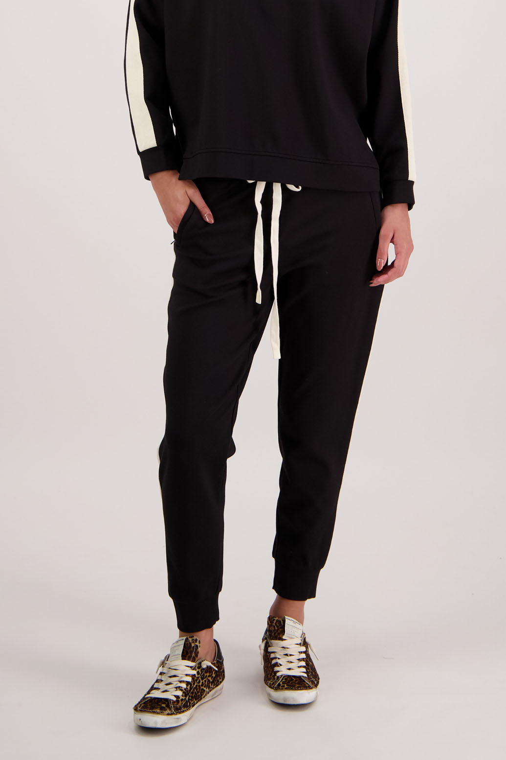 BESTSELLER. Claudia Pant by Briarwood NZ. Pont Pant with zip pockets, elastic waist with tie cord, cuffed legs and contrast side stripe.