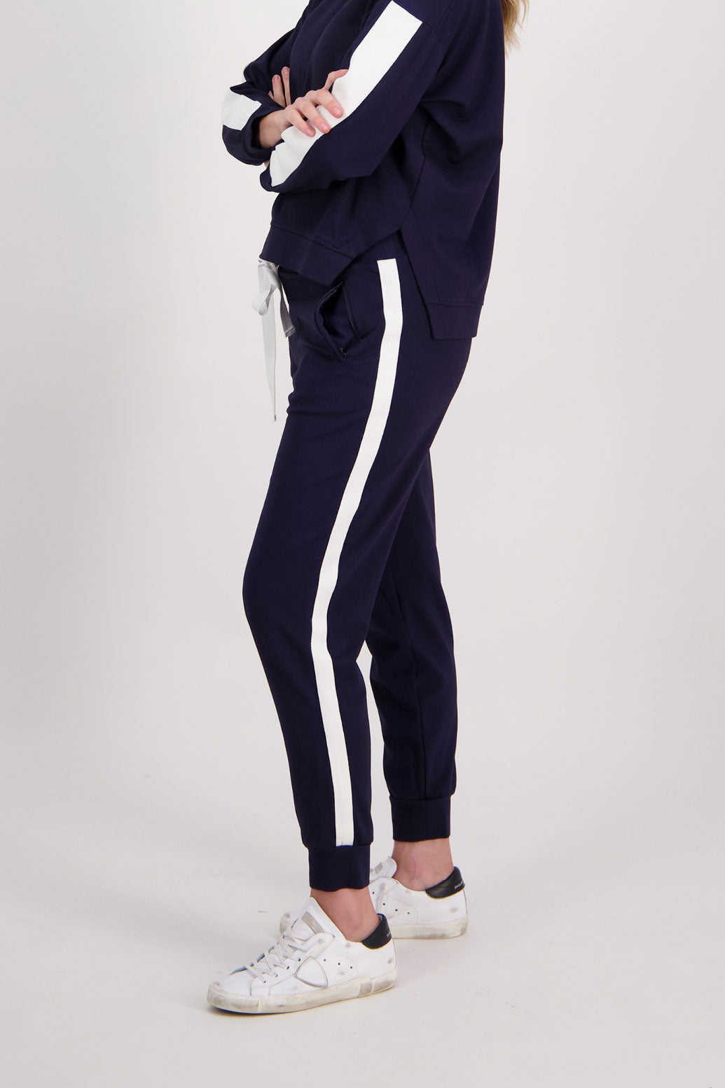 Ink Ponte Slim Fit Pant with White/Ivory Side Stripe. ZIppped pockets and wide cuff. Claudia