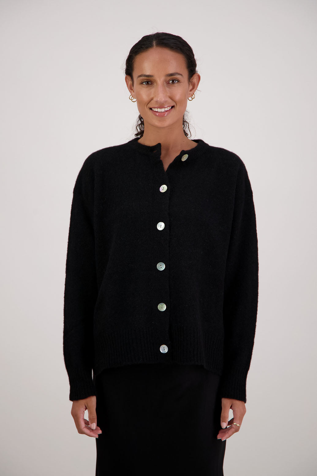 Fable Cardigan in Black by Briarwood NZ. Alpaca/Wool blend long sleeve cardigan with side splits and longer at the back