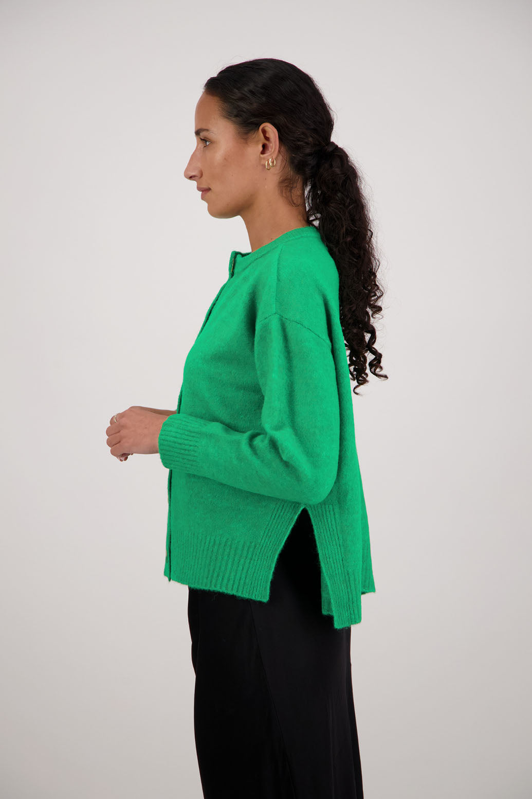 Fable Cardigan in Green by Briarwood NZ. Alpaca/Wool blend long sleeve cardigan with side splits and longer at the back