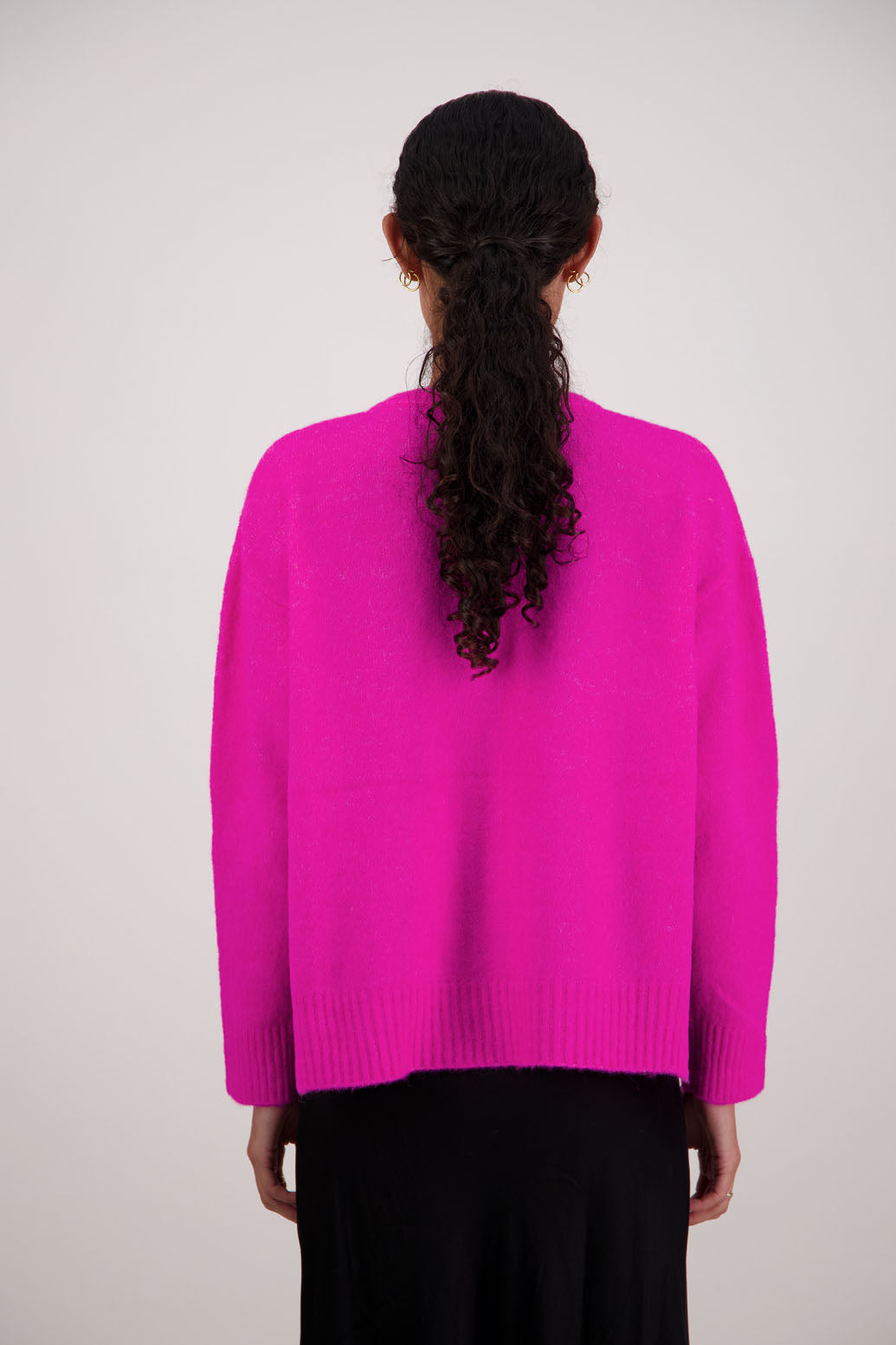Fable Cardigan in Pink by Briarwood NZ. Alpaca/Wool blend long sleeve cardigan with side splits and longer at the back