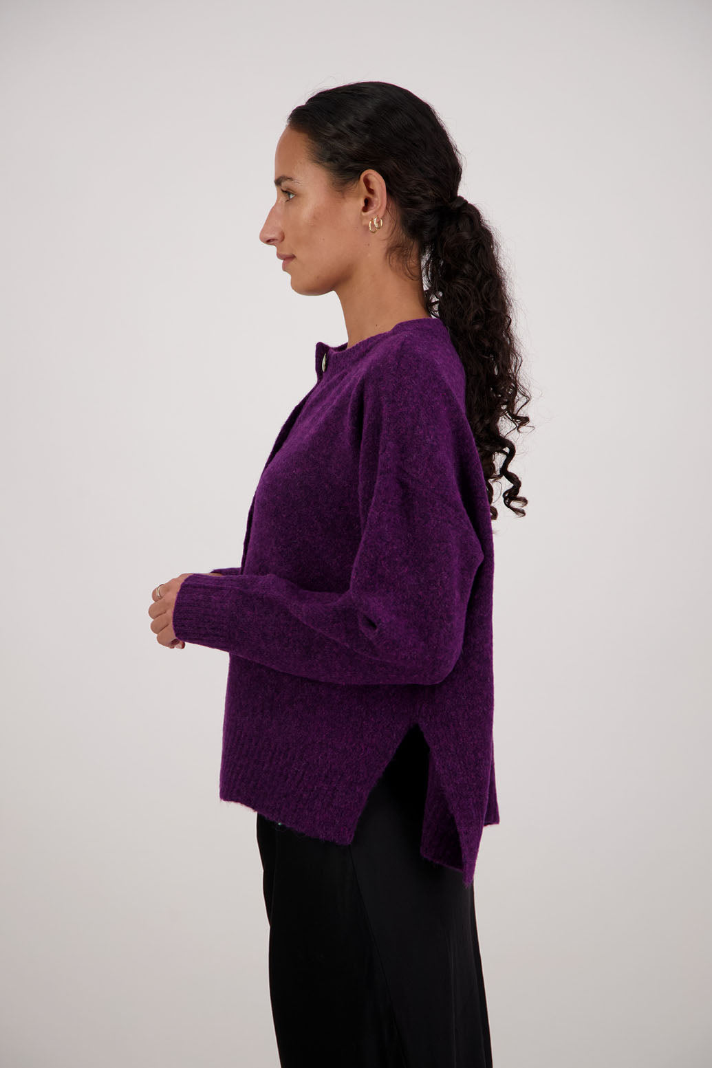 Fable Cardigan in Purple by Briarwood NZ. Alpaca/Wool blend long sleeve cardigan with side splits and longer at the back
