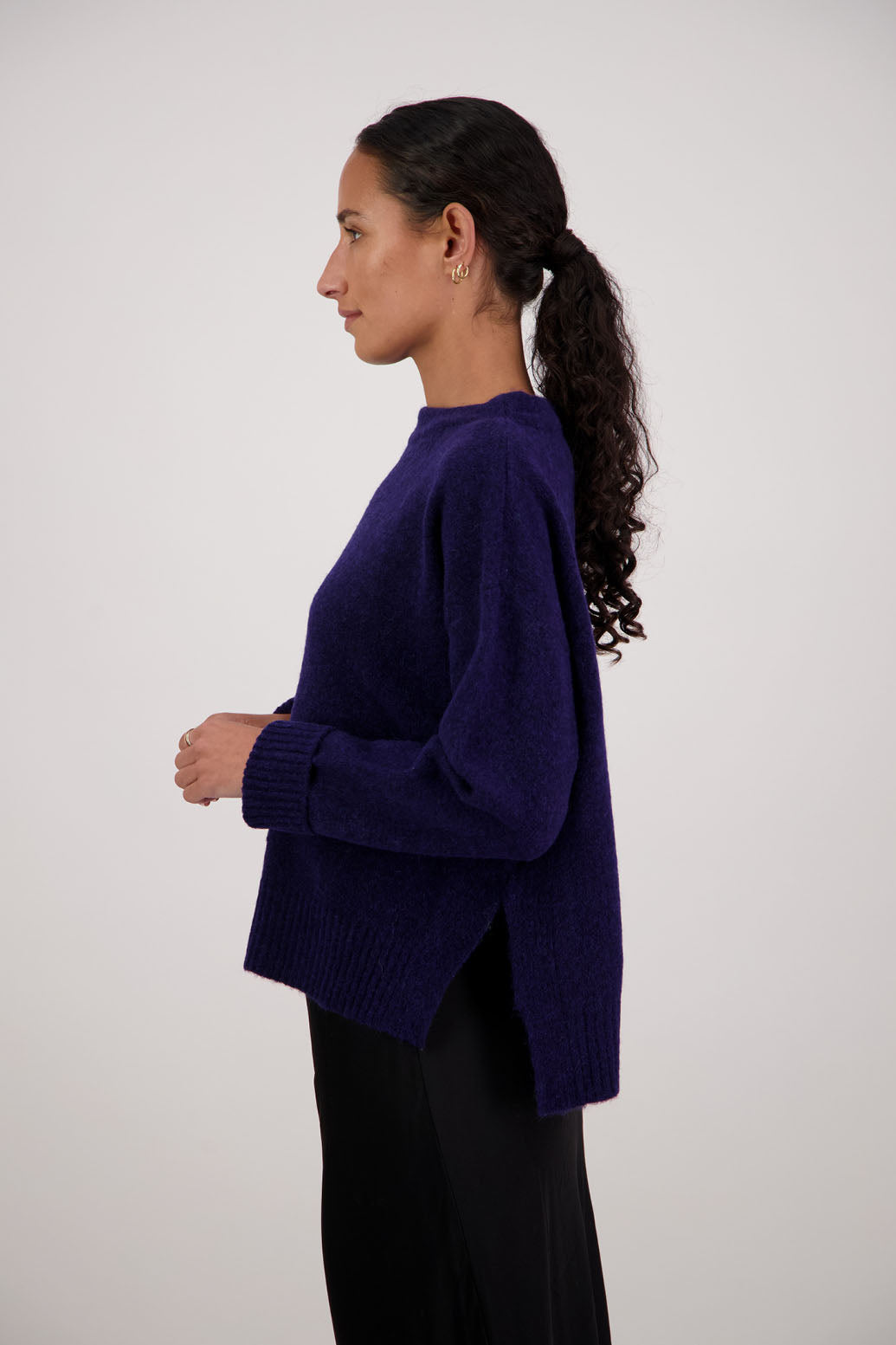 Feather Jumper in Ink by Briarwood NZ. Alpaca/Wool blend long sleeve, funnel neck jumper with side splits and longer at the back