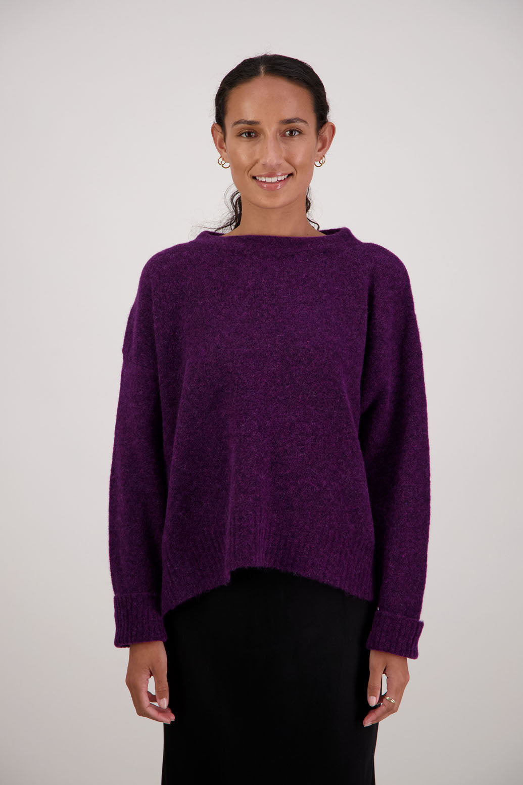 Feather Jumper in Purple by Briarwood NZ. Alpaca/Wool blend long sleeve, funnel neck jumper with side splits and longer at the back