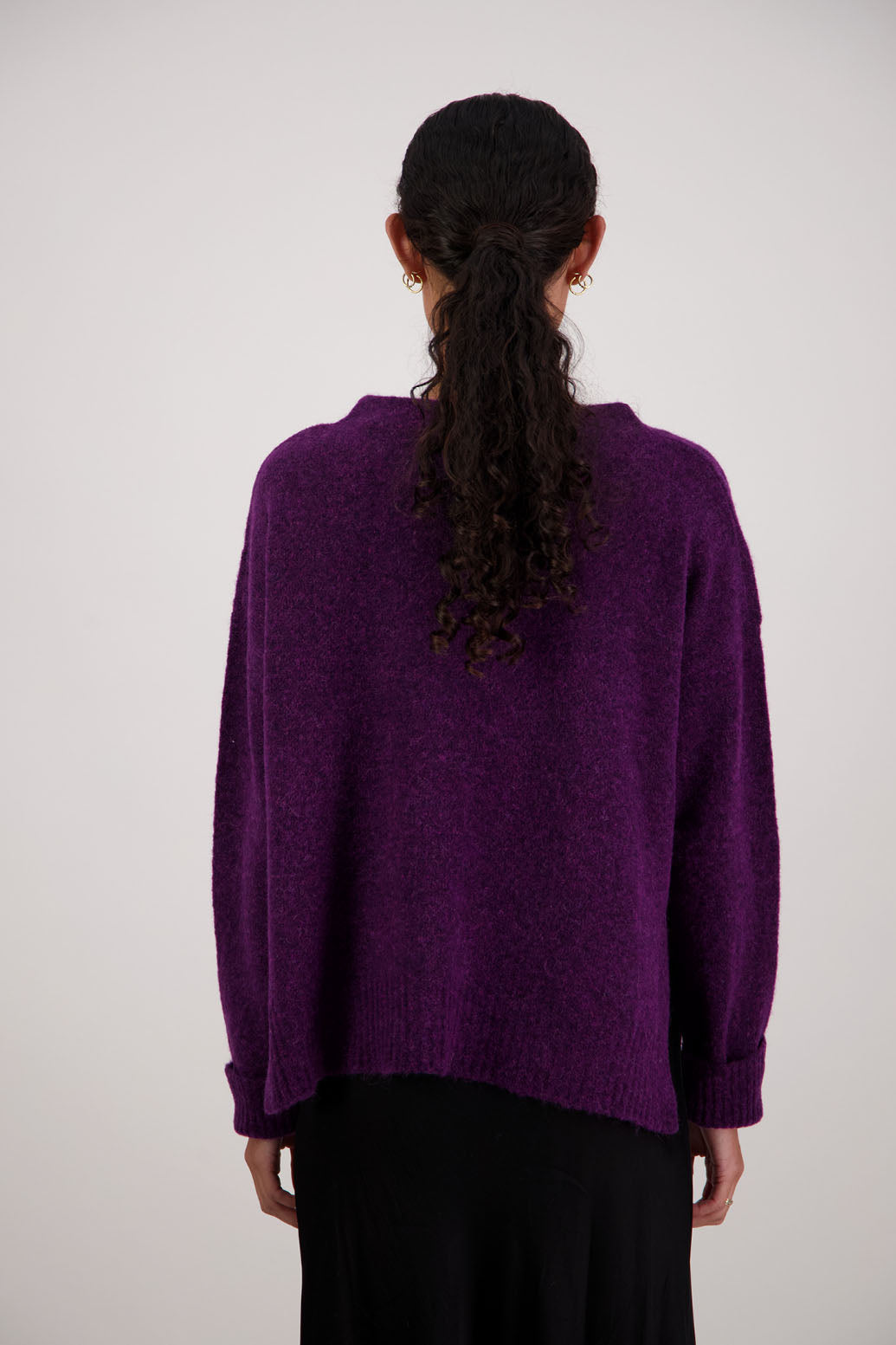Feather Jumper in Purple by Briarwood NZ. Alpaca/Wool blend long sleeve, funnel neck jumper with side splits and longer at the back