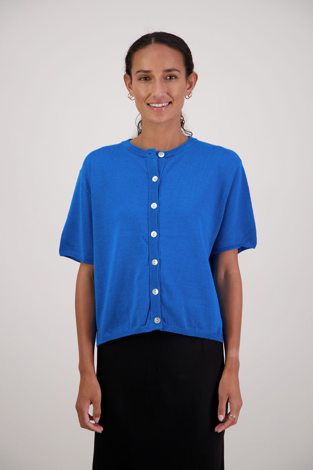 Felix Wool Cardigan in Turquoise by Briarwood NZ. 100% Wool cardigan with short sleeves, buttoned front, box fit