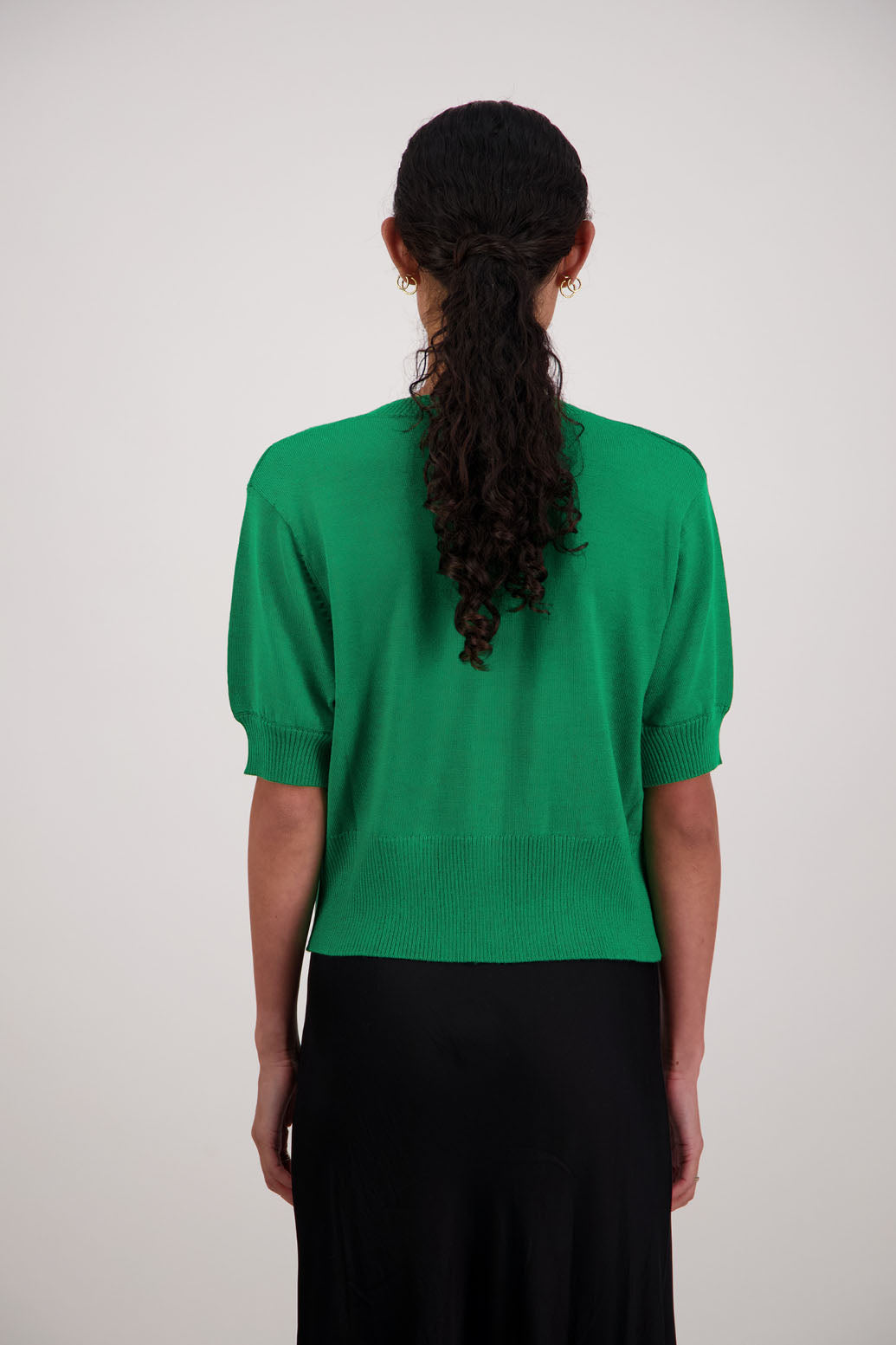 French Wool Cardigan in Emerald by Briarwood NZ. 100% Wool cardigan with short sleeves, buttoned front, wide waist band and self pattern on front