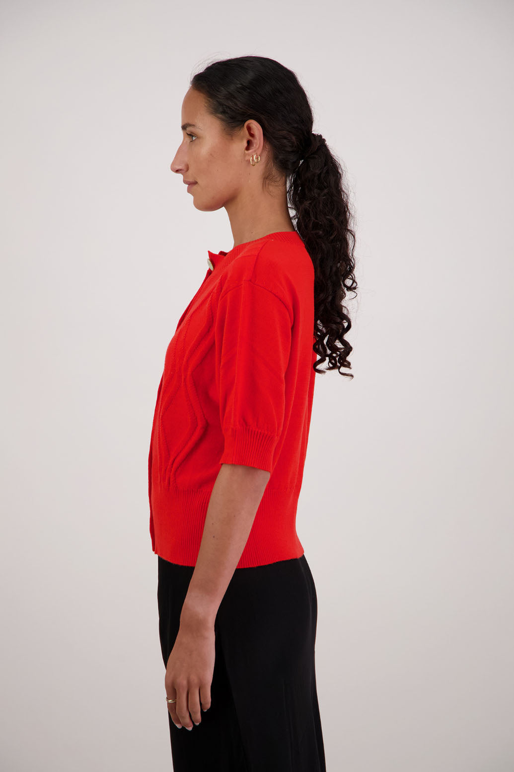 French Wool Cardigan in Orange by Briarwood NZ. 100% Wool cardigan with short sleeves, buttoned front, wide waist band and self pattern on front