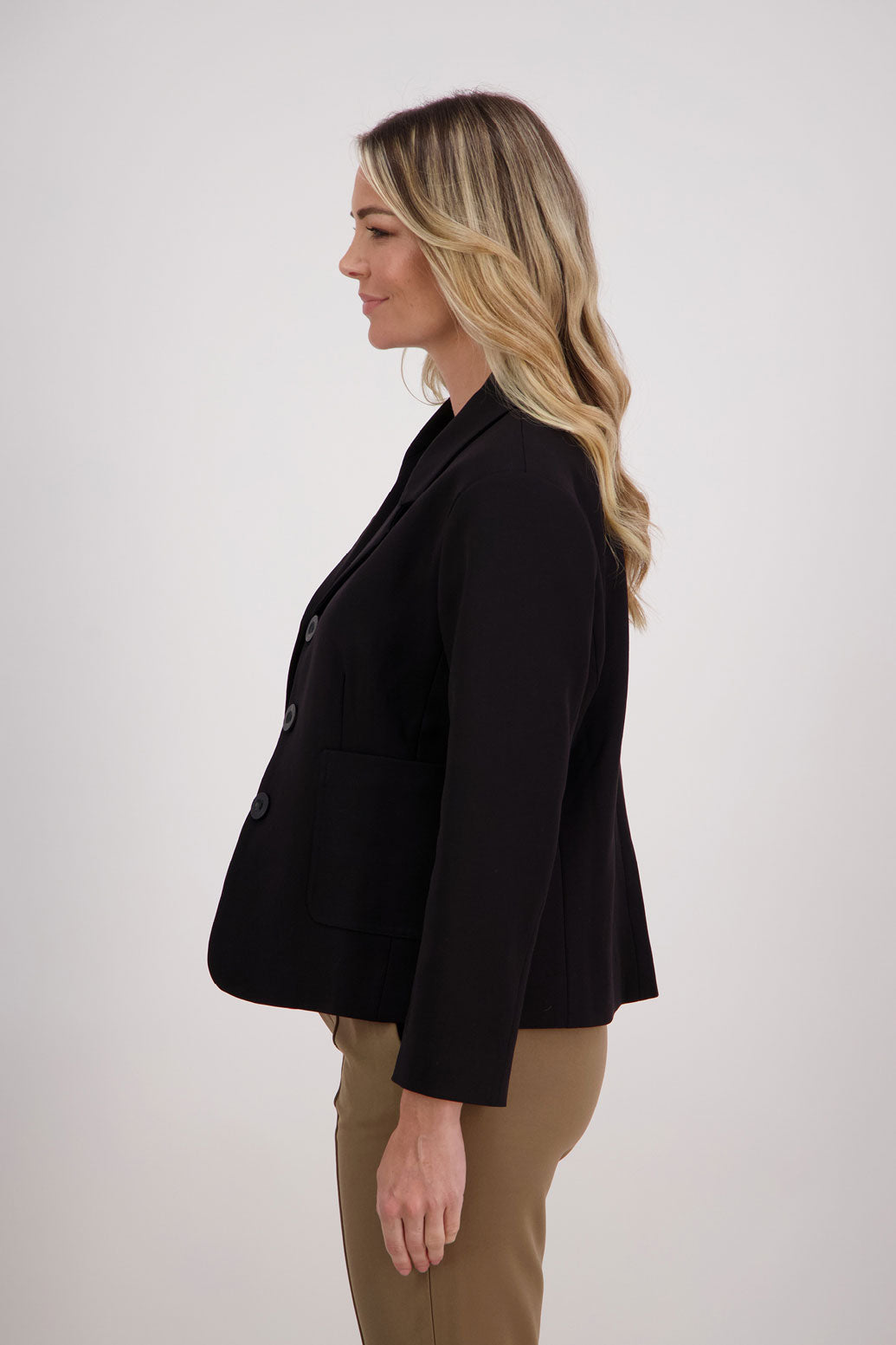 Black blazer with subtle shaping and fuchsia/pink lining. Harris