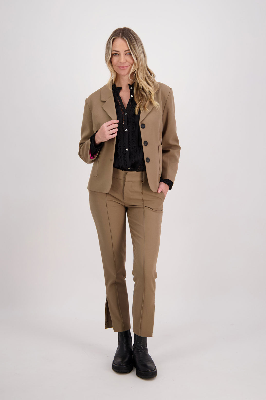 Camel blazer with subtle shaping and fuchsia/pink lining. Harris