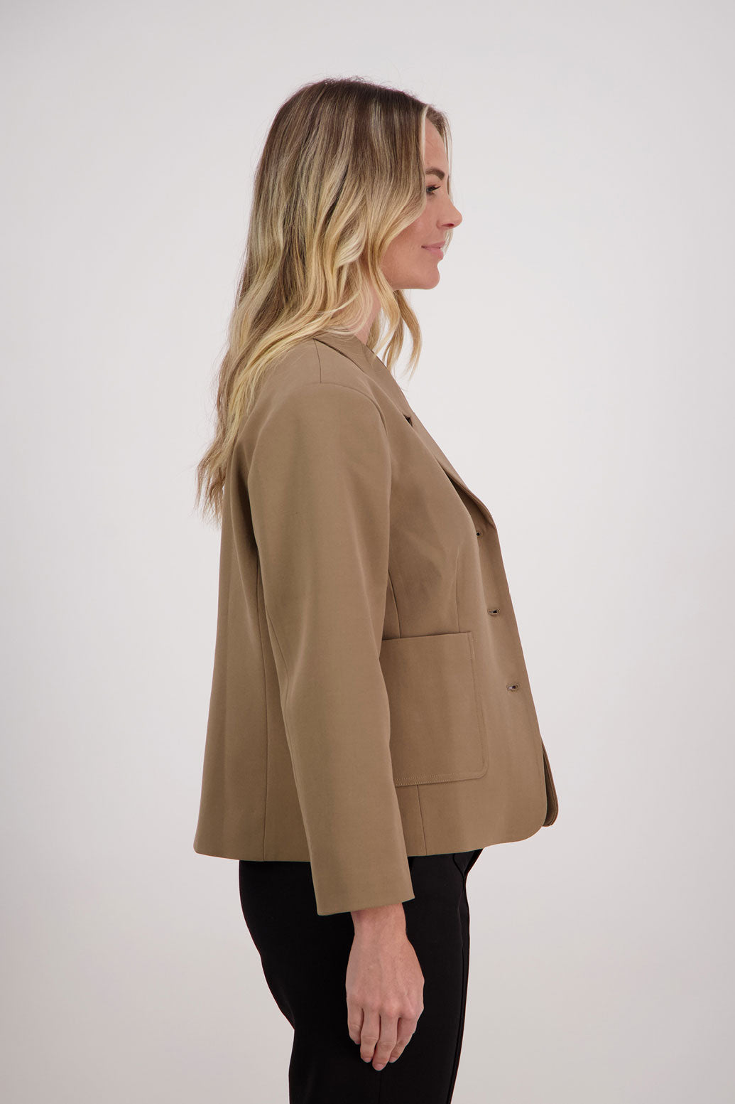 Camel blazer with subtle shaping and fuchsia/pink lining. Harris