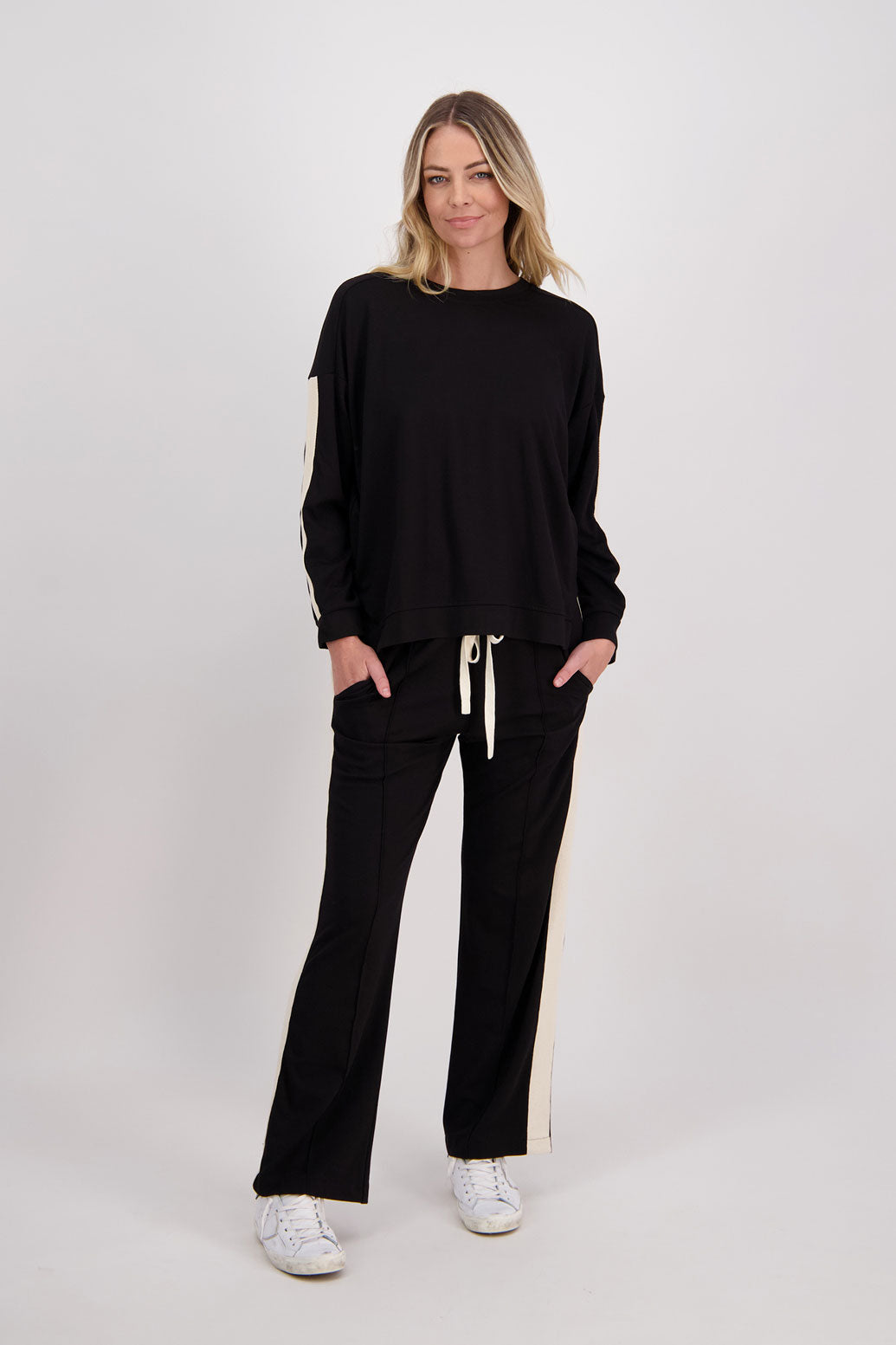 Black wide leg Ponte Pant with White/Ivory Side Stripe down the side of leg. Hector