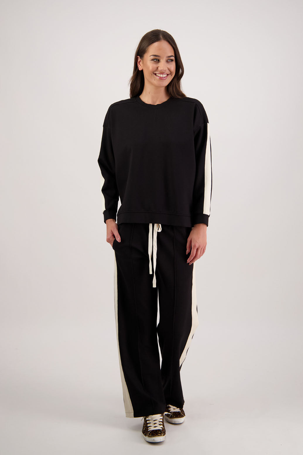 BESTSELLER. Hector pant in Black by Briarwood NZ. Ponte pant with elasticated waist with draw cord, pin tuck front & back, pockets and contrast side stripe