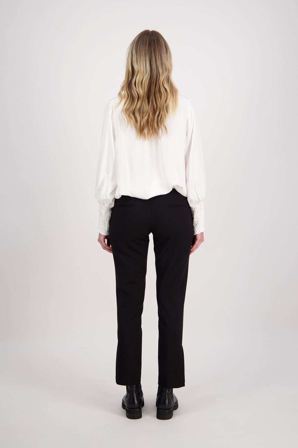 Black tailored pant with side splits and zips. Front pin stitch detail. Helena