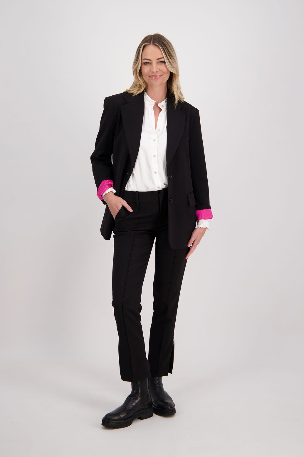 Black tailored pant with side splits and zips. Front pin stitch detail. Helena