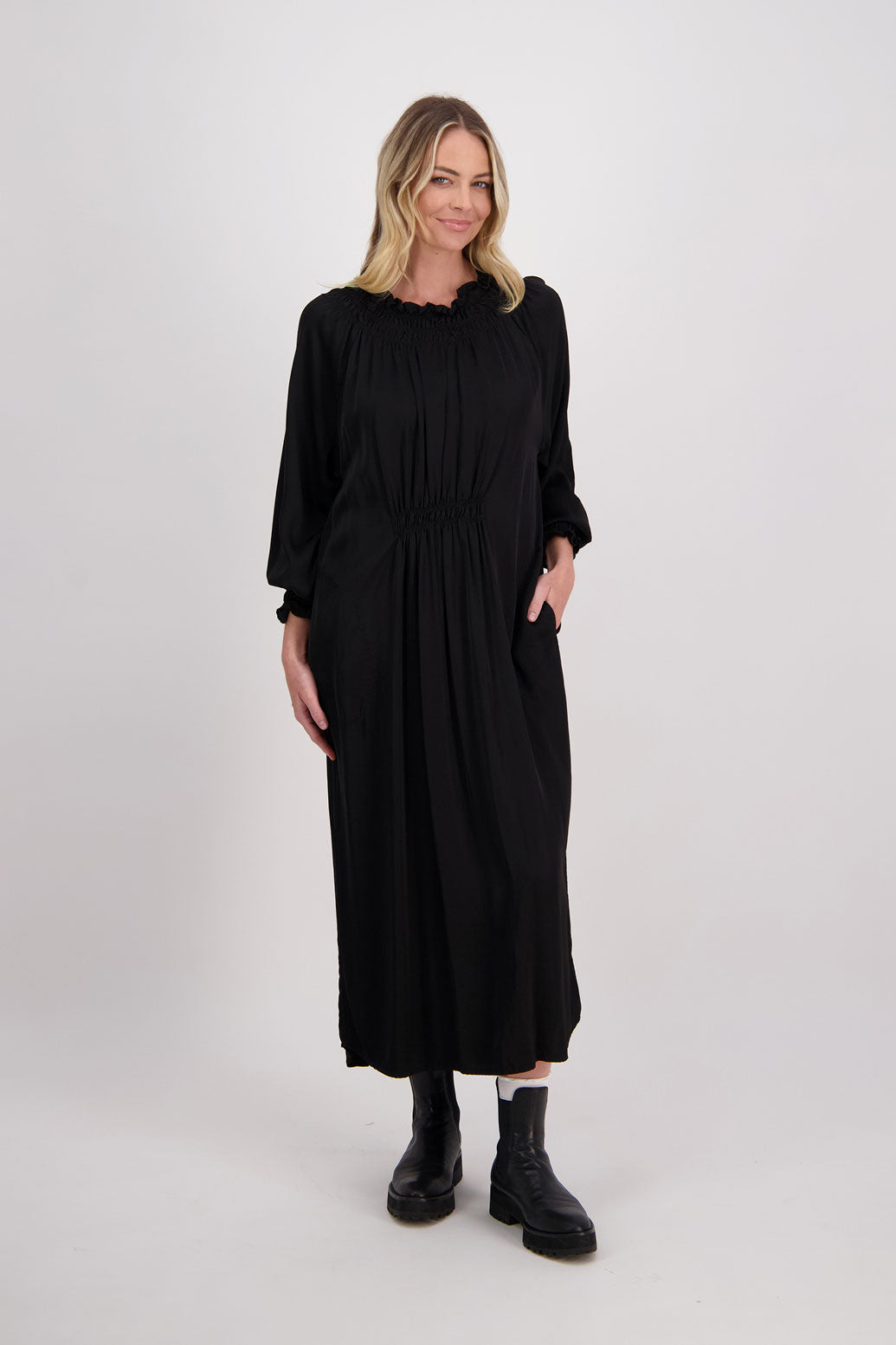 Black Briarwood viscose full length dress with shirt hem detail. Shirred detail around the neck, waist and sleeves. Shirred waistline detail at front and back gives gentle shape. Henna