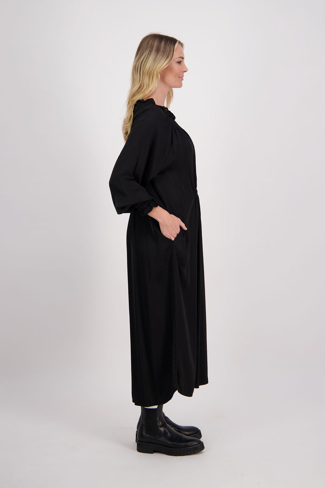 Black Briarwood viscose full length dress with shirt hem detail. Shirred detail around the neck, waist and sleeves. Shirred waistline detail at front and back gives gentle shape. Henna