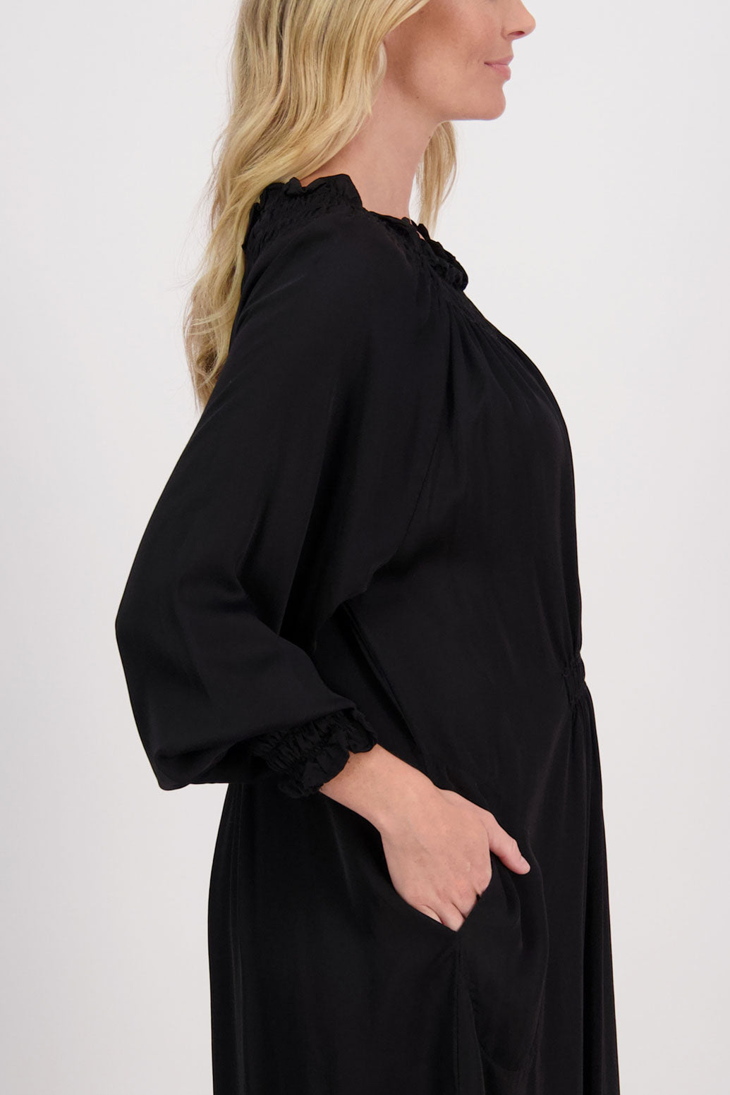 Black Briarwood viscose full length dress with shirt hem detail. Shirred detail around the neck, waist and sleeves. Shirred waistline detail at front and back gives gentle shape. Henna