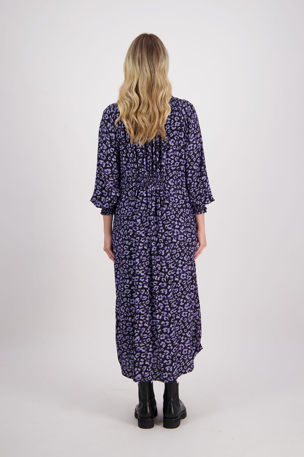 Blue Animal Briarwood viscose full length dress with shirt hem detail. Shirred detail around the neck, waist and sleeves. Shirred waistline detail at front and back gives gentle shape. Henna