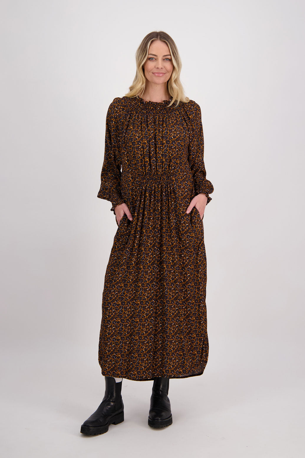 Brown Animal Briarwood viscose full length dress with shirt hem detail. Shirred detail around the neck, waist and sleeves. Shirred waistline detail at front and back gives gentle shape. Henna