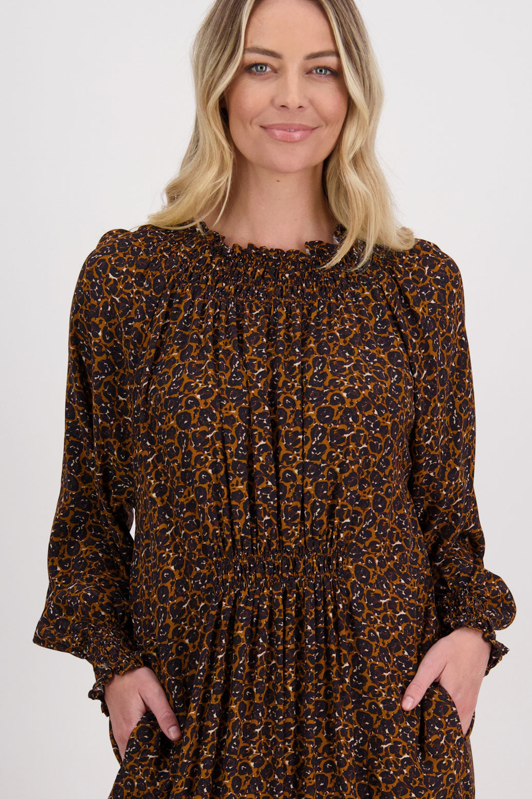 Brown Animal Briarwood viscose full length dress with shirt hem detail. Shirred detail around the neck, waist and sleeves. Shirred waistline detail at front and back gives gentle shape. Henna