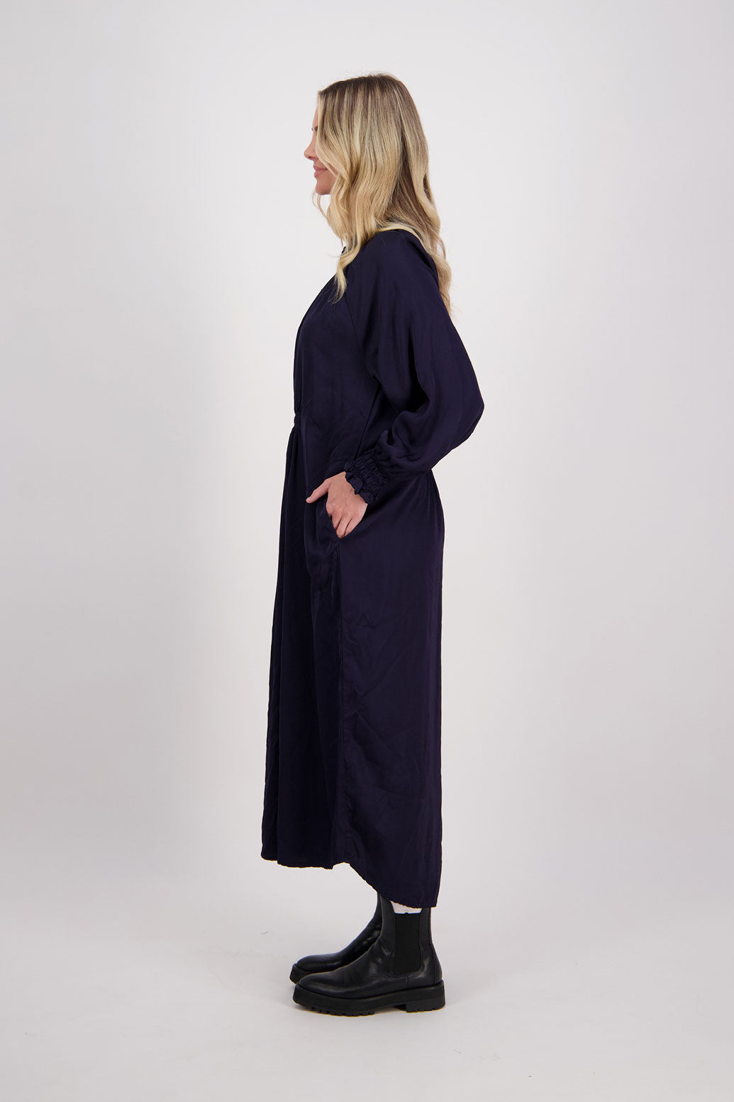 Ink/Navy Blue Briarwood viscose full length dress with shirt hem detail. Shirred detail around the neck, waist and sleeves. Shirred waistline detail at front and back gives gentle shape. Henna