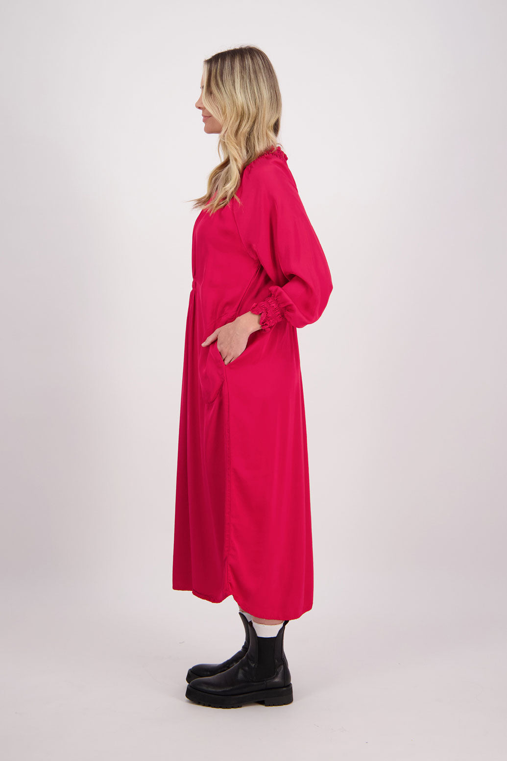 Red Briarwood viscose full length dress with shirt hem detail. Shirred detail around the neck, waist and sleeves. Shirred waistline detail at front and back gives gentle shape. Henna