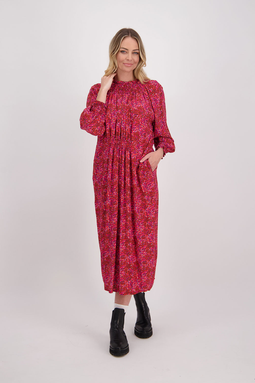 Red Floral Briarwood viscose full length dress with shirt hem detail. Shirred detail around the neck, waist and sleeves. Shirred waistline detail at front and back gives gentle shape. Henna