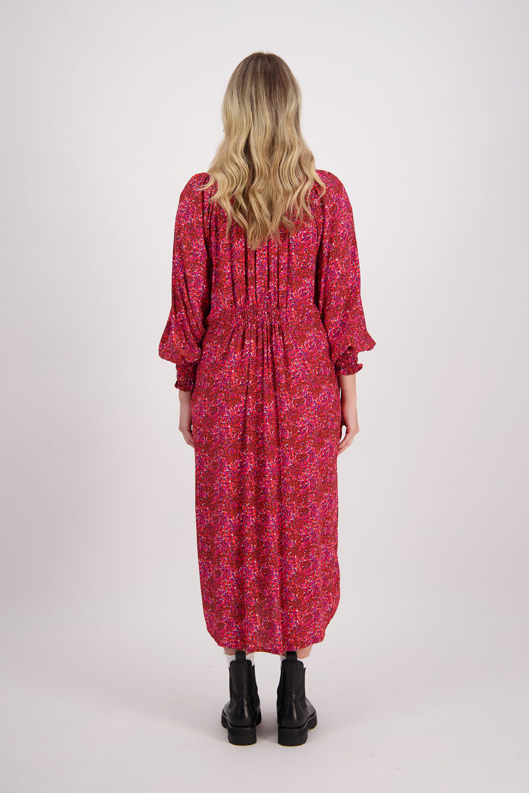 Red Floral Briarwood viscose full length dress with shirt hem detail. Shirred detail around the neck, waist and sleeves. Shirred waistline detail at front and back gives gentle shape. Henna