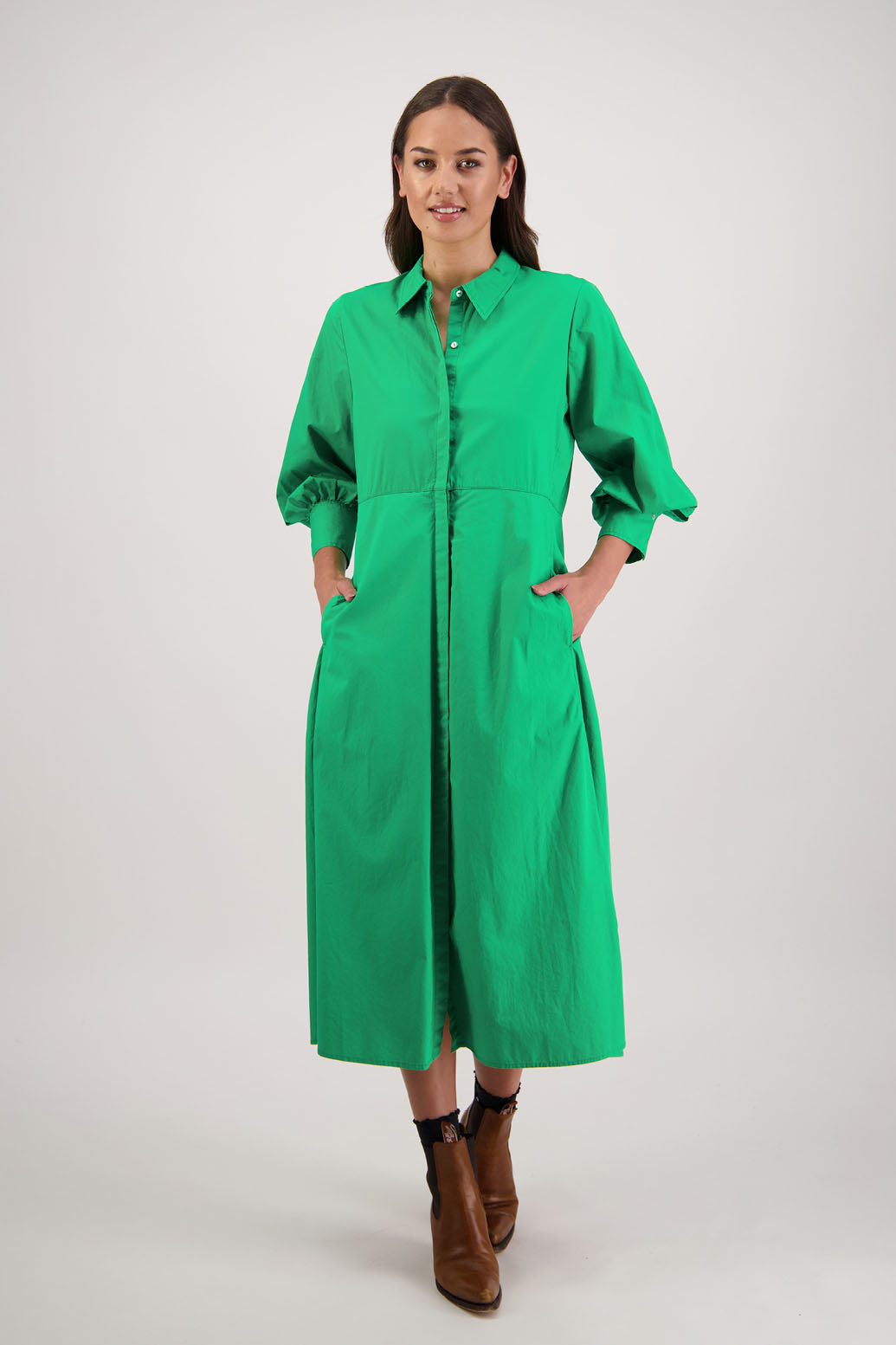Henrietta Shirt Dress in Apple by Briarwood NZ. Made from Cotton Poplin with long full length sleeves, fitted through the body, fitted through the maxi with maxi a-line skirt, hidden button front and extended cuff with 2 buttons