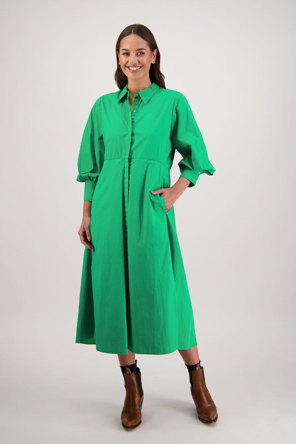 Henrietta Shirt Dress in Apple by Briarwood NZ. Made from Cotton Poplin with long full length sleeves, fitted through the body, fitted through the maxi with maxi a-line skirt, hidden button front and extended cuff with 2 buttons