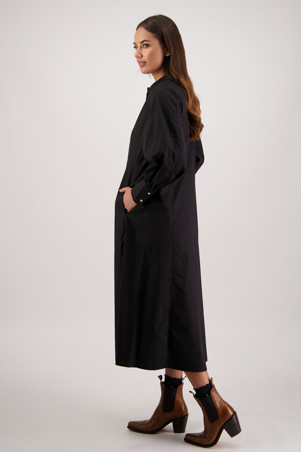 Henrietta Shirt Dress in Black by Briarwood NZ. Made from Cotton Poplin with long full length sleeves, fitted through the body, fitted through the maxi with maxi a-line skirt, hidden button front and extended cuff with 2 buttons