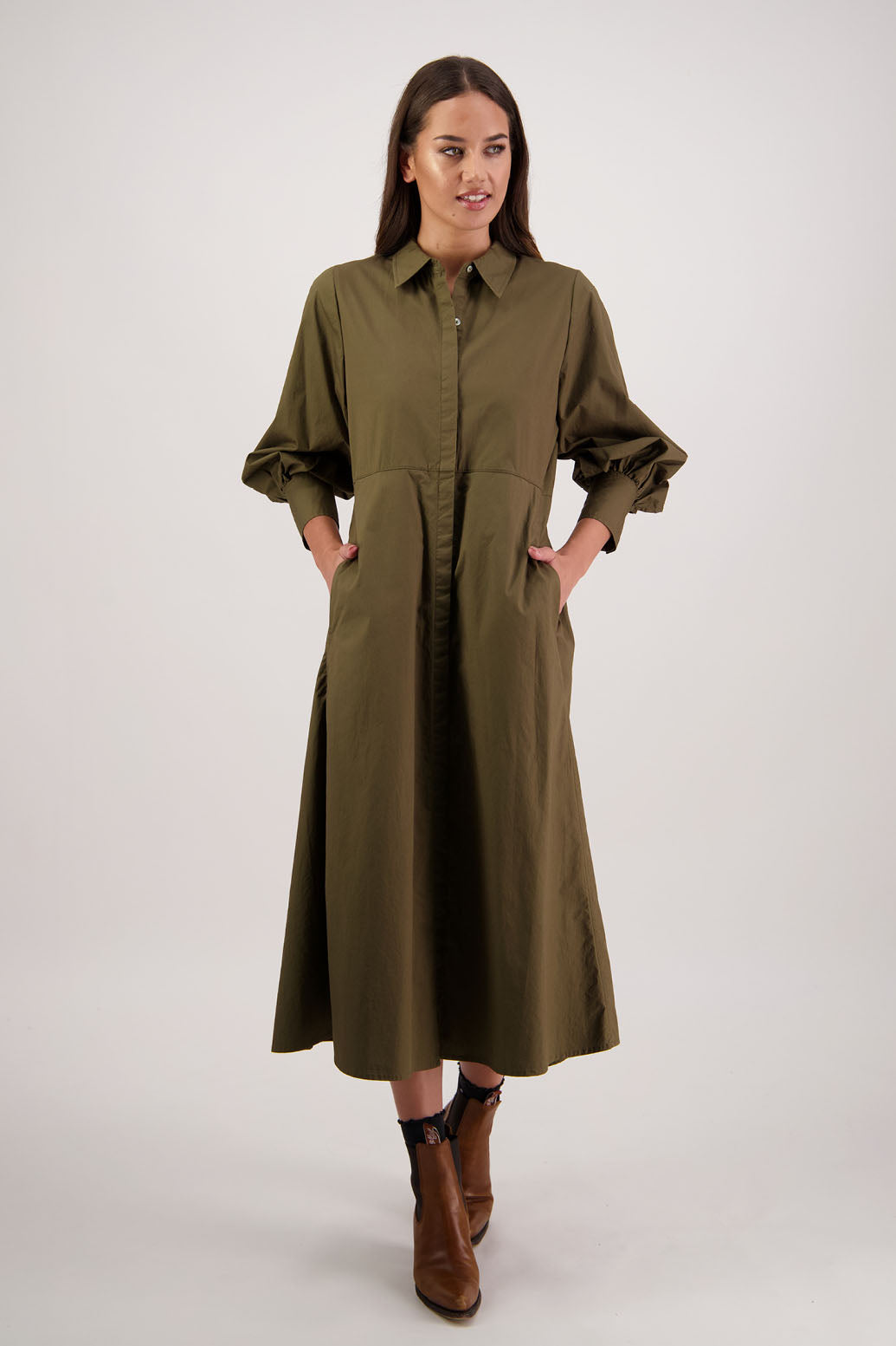 Henrietta Shirt Dress in Khaki by Briarwood NZ. Made from Cotton Poplin with long full length sleeves, fitted through the body, fitted through the maxi with maxi a-line skirt, hidden button front and extended cuff with 2 buttons