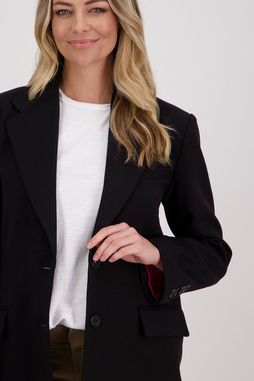 Black longline blazer with fucshia lining. Hilary