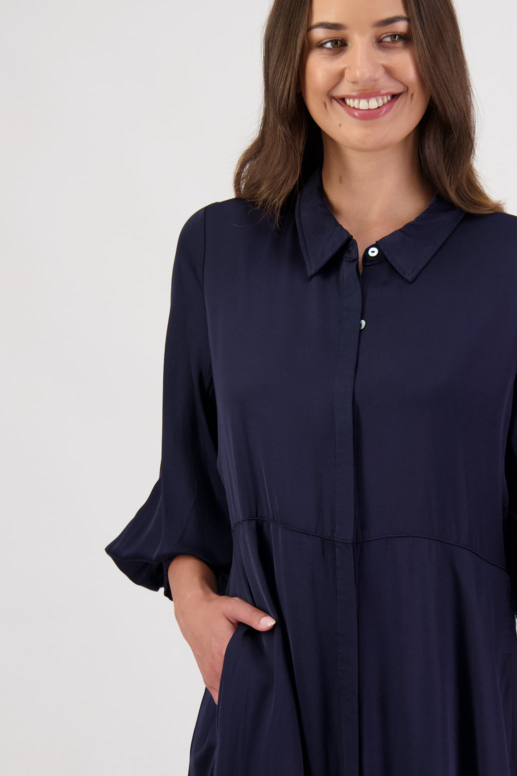 Hollie Ink Shirt Dress by Briarwood NZ. 100% Viscose shirt dress with long full length sleeves, fitted through the body, A-line skirt, Hidden button down front, extended cuff with 2 button closure