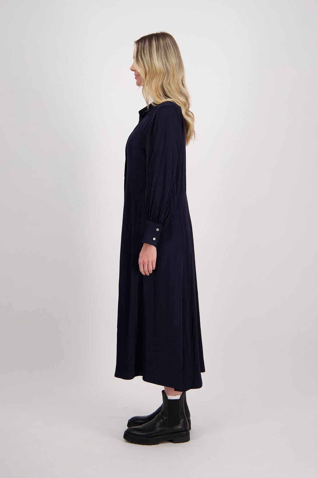 Ink/Dark Blue Shirt Dress, maxi length, long sleeves. Fitted through the body draping to A Line skirt. Hidden button front with extended cuffs. Hollie