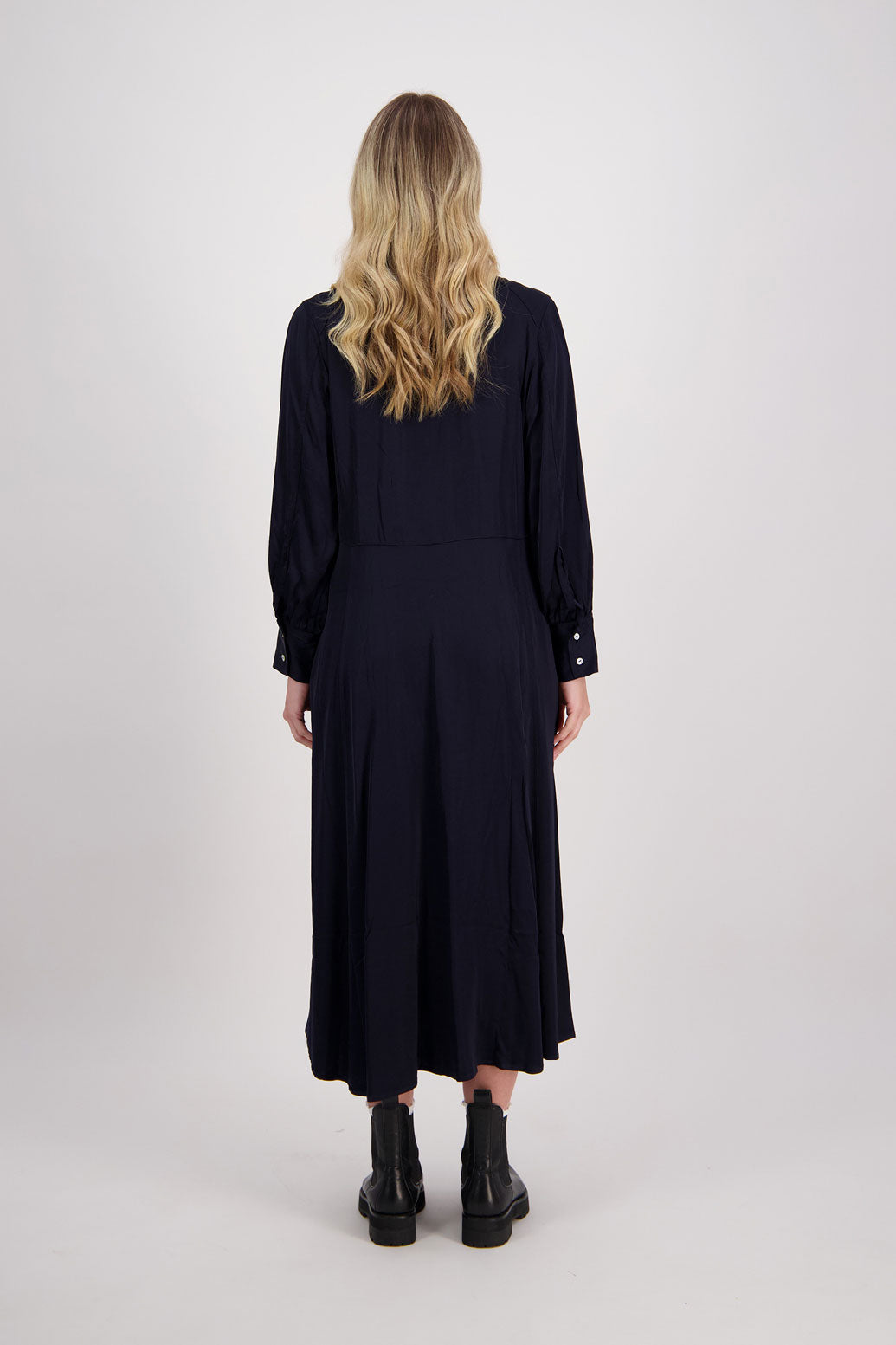 Ink/Dark Blue Shirt Dress, maxi length, long sleeves. Fitted through the body draping to A Line skirt. Hidden button front with extended cuffs. Hollie