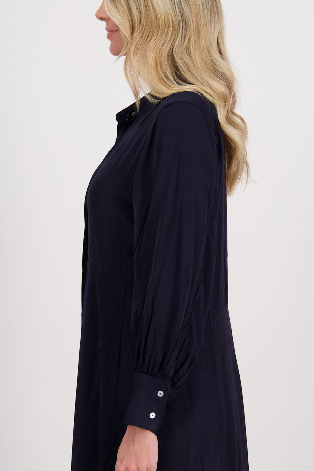 Ink/Dark Blue Shirt Dress, maxi length, long sleeves. Fitted through the body draping to A Line skirt. Hidden button front with extended cuffs. Hollie