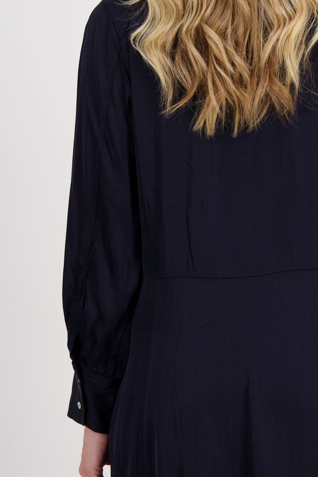 Ink/Dark Blue Shirt Dress, maxi length, long sleeves. Fitted through the body draping to A Line skirt. Hidden button front with extended cuffs. Hollie