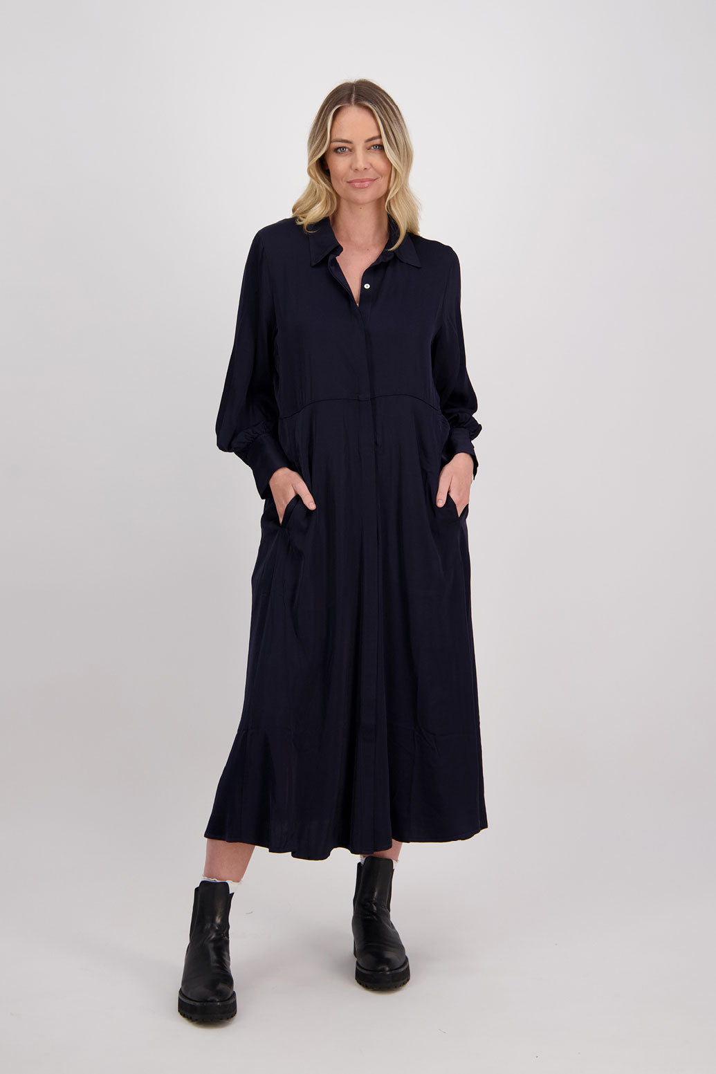 Ink/Dark Blue Shirt Dress, maxi length, long sleeves. Fitted through the body draping to A Line skirt. Hidden button front with extended cuffs. Hollie